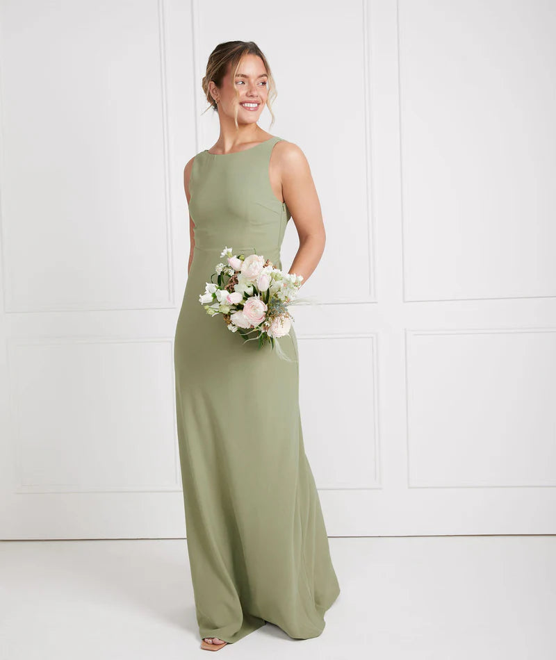 Girl wearing sage green crepe bridesmaid dress