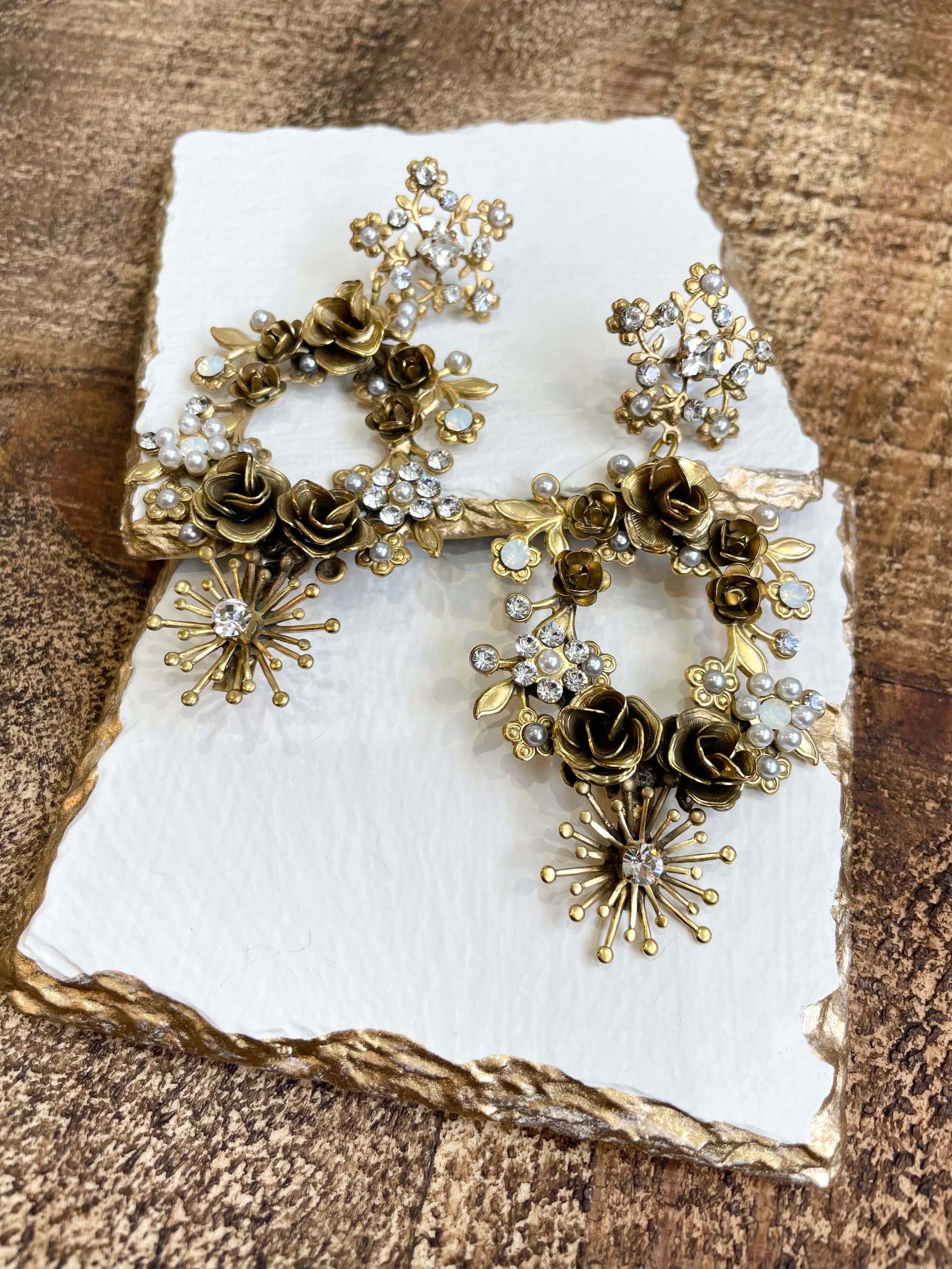 Introducing the Paige Earrings, a truly unique statement piece designed to captivate and enchant. Drawing inspiration from vintage elegance and timeless femininity, these earrings are more than just accessories—they're wearable heirlooms, imbued with old-world charm and modern sophistication.