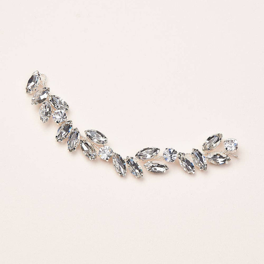 Add a radiant touch of glamour to your wedding day ensemble with the Skyla Crystal Headpiece—a breathtaking accessory designed to dazzle with every step you take. Whether you're envisioning a romantic garden ceremony or an elegant ballroom affair, Skyla brings a refined shimmer that enhances your bridal style with effortless beauty.