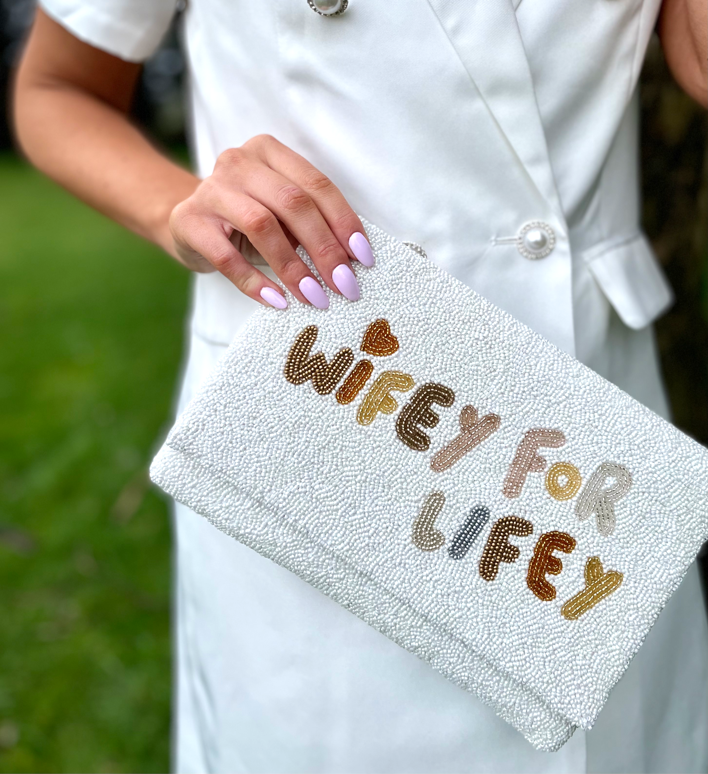 Lady holding Wifey for Lifey Wedding Clutch Bag
