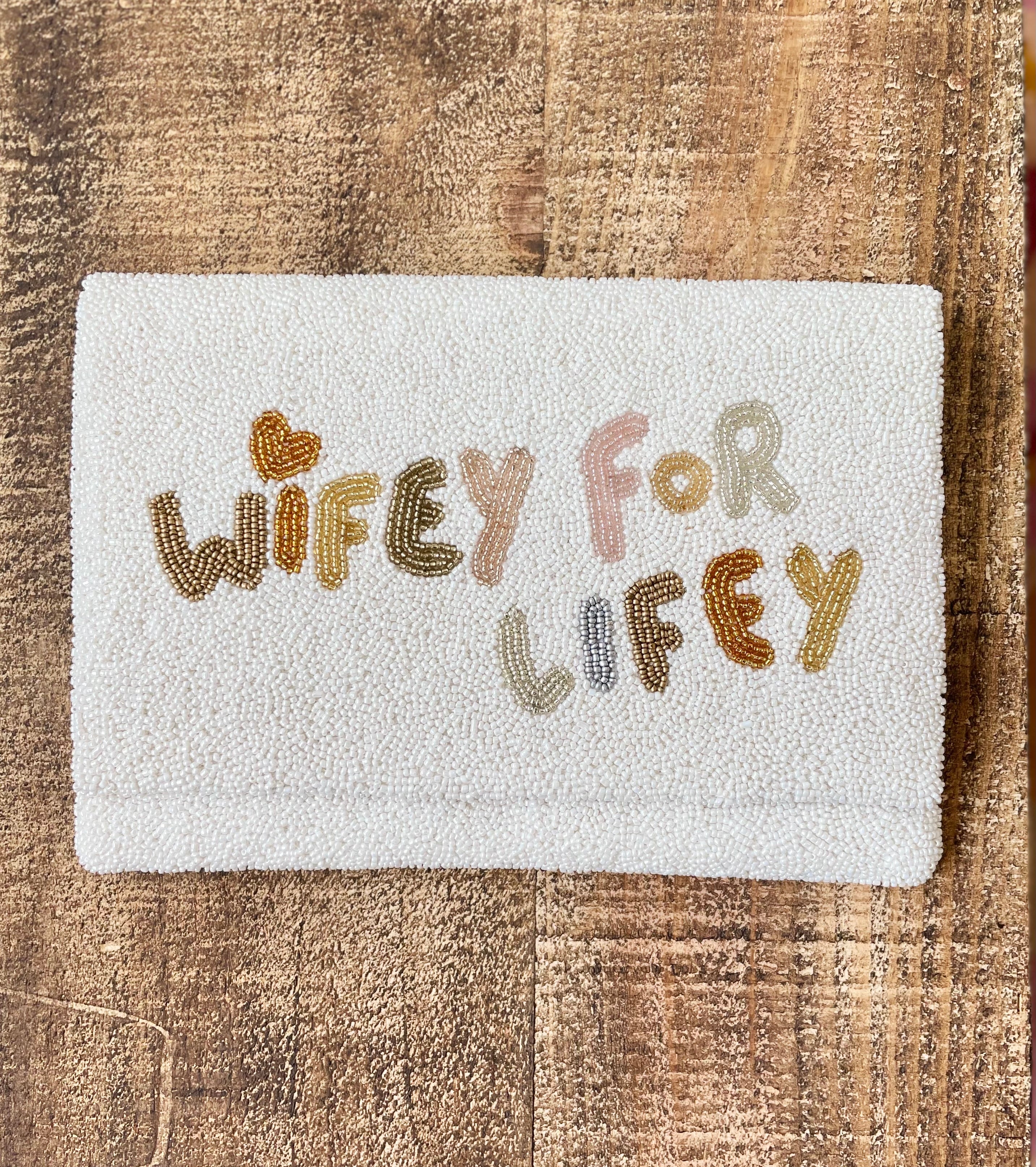 wifey for lifey beaded bridal handbag on wooden shelf