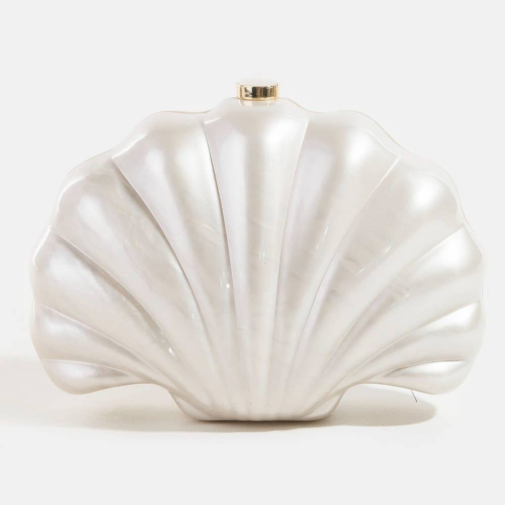 Shell-shaped white pearlescent bridal clutch bag on a light grey background