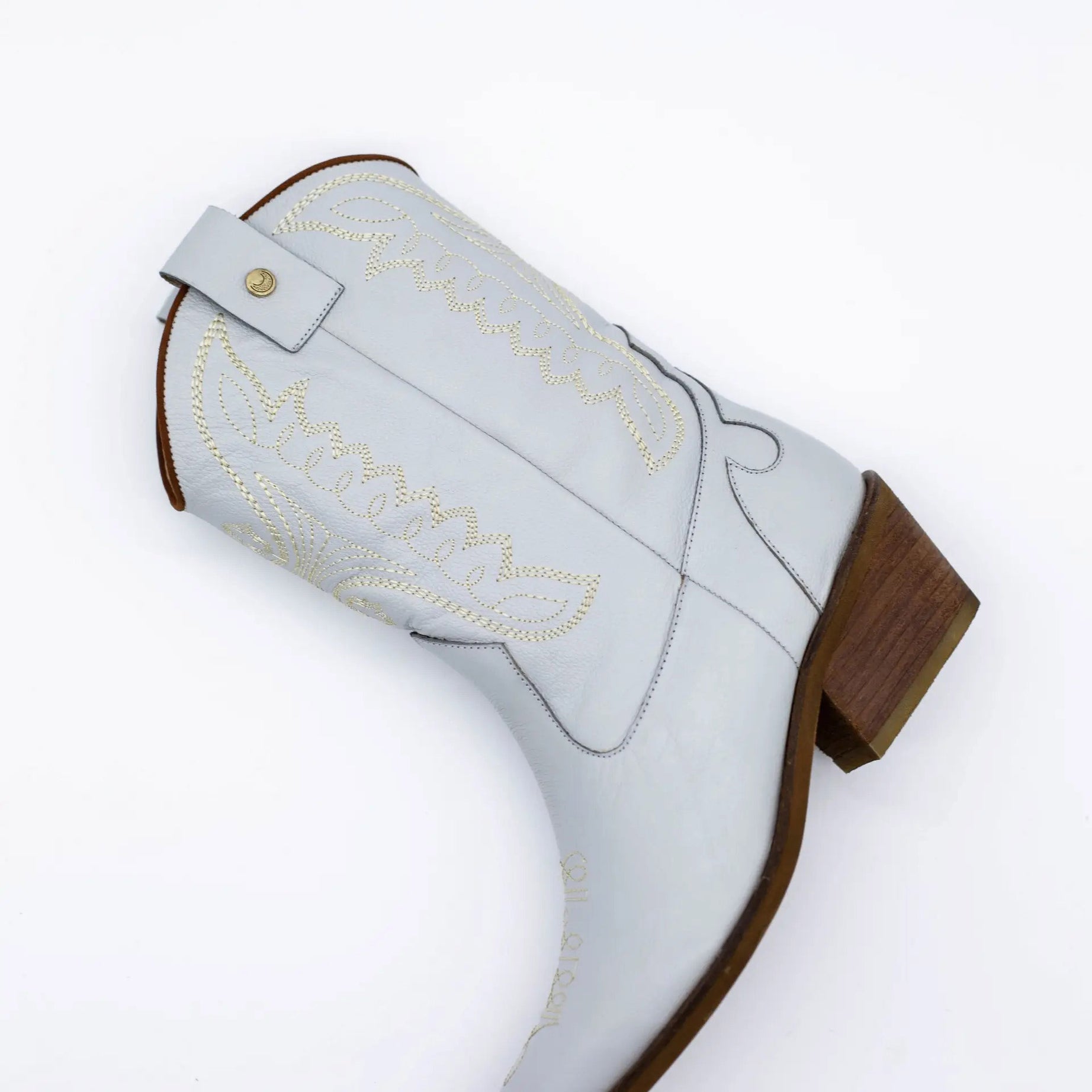 Introducing the Luna Authentic &amp; Original Cowboy Boot — a handcrafted statement piece designed for unstoppable style, comfort, and individuality. The Luna boot is where rustic tradition meets modern elegance, offering a fresh twist on the timeless cowboy boot silhouette. Whether you're walking down the aisle or dancing under the stars, Luna brings a unique edge to your look with artisanal detailing and heritage craftsmanship.