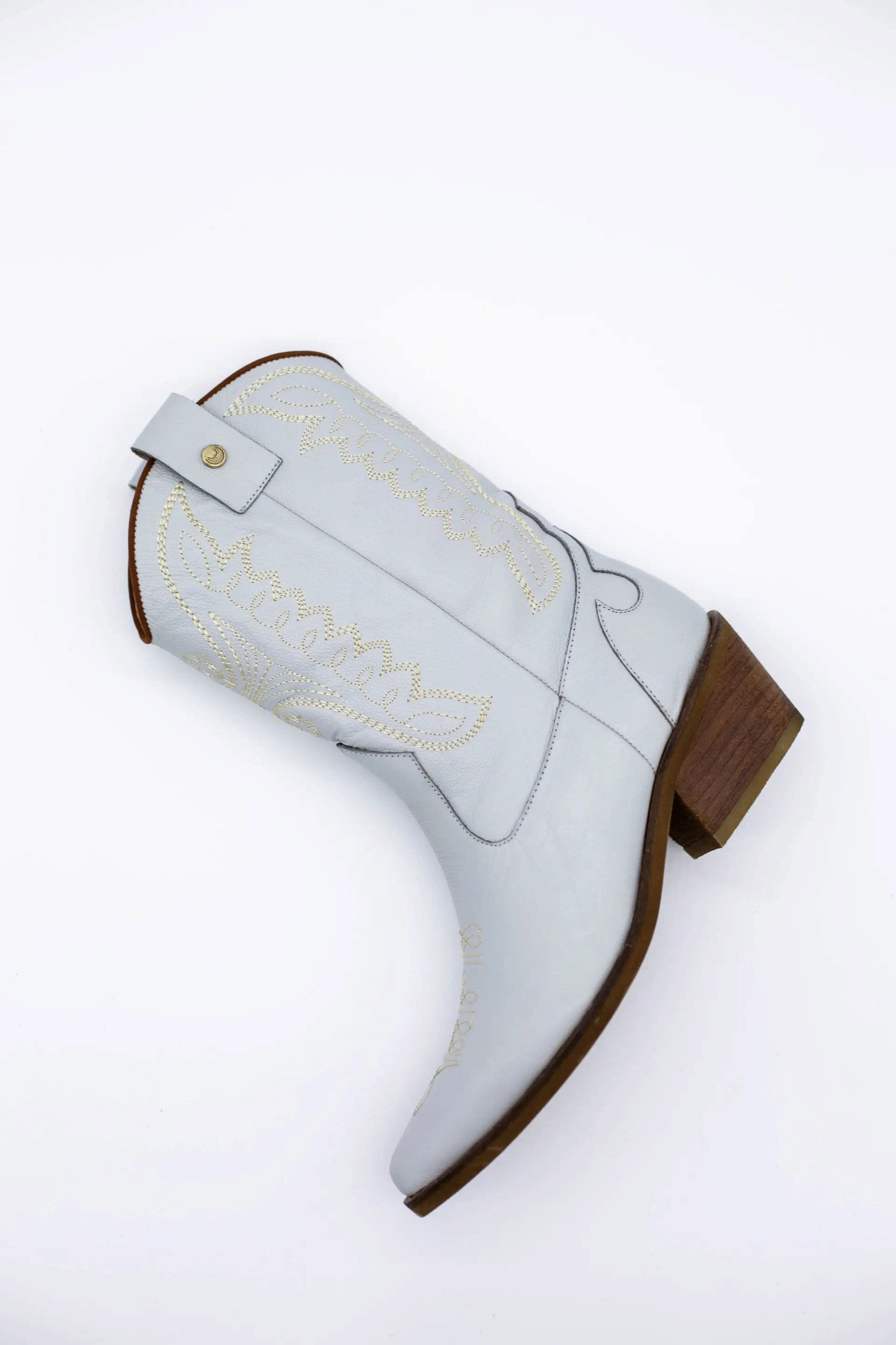 Introducing the Luna Authentic &amp; Original Cowboy Boot — a handcrafted statement piece designed for unstoppable style, comfort, and individuality. The Luna boot is where rustic tradition meets modern elegance, offering a fresh twist on the timeless cowboy boot silhouette. Whether you're walking down the aisle or dancing under the stars, Luna brings a unique edge to your look with artisanal detailing and heritage craftsmanship.