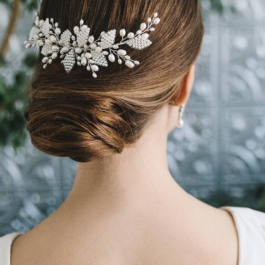 Add timeless elegance to your bridal look with this Aria pearl floral hair comb. Perfect for weddings and special occasions. Handmade, lightweight and easy to wear