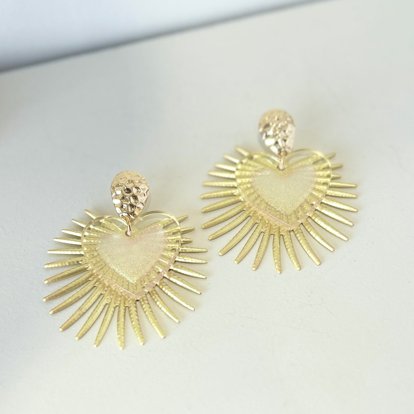 Gold heart shape statement earrings