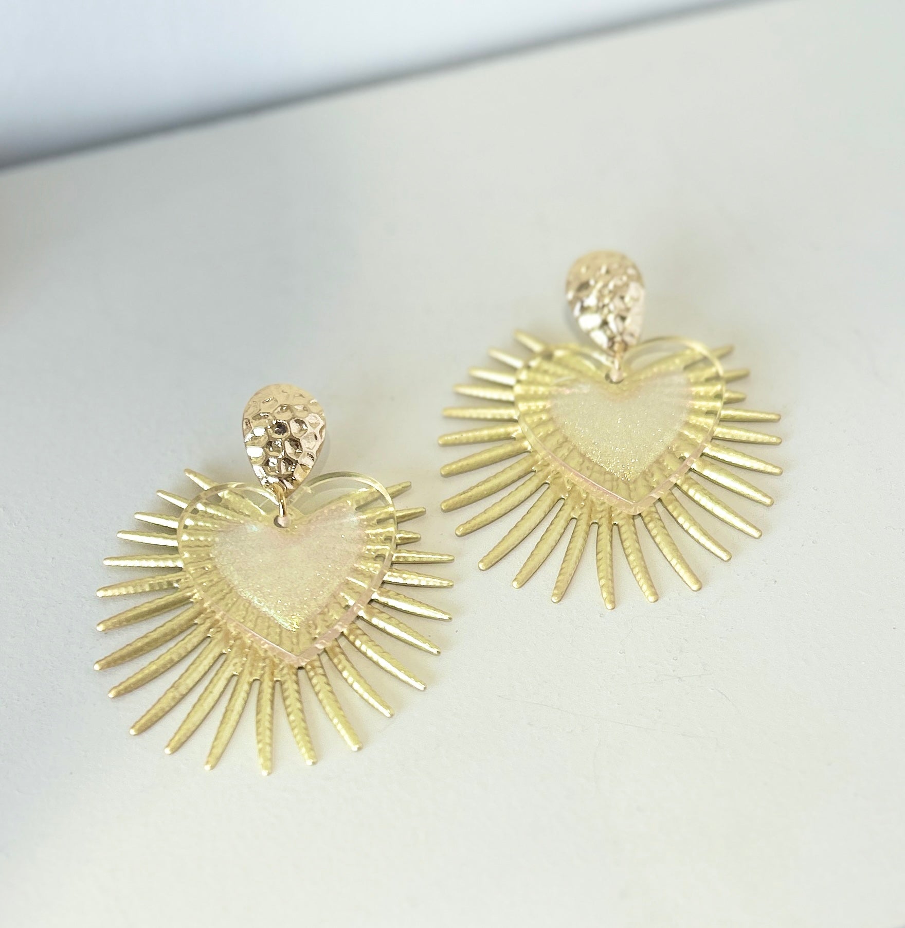 Gold heart shape statement earrings