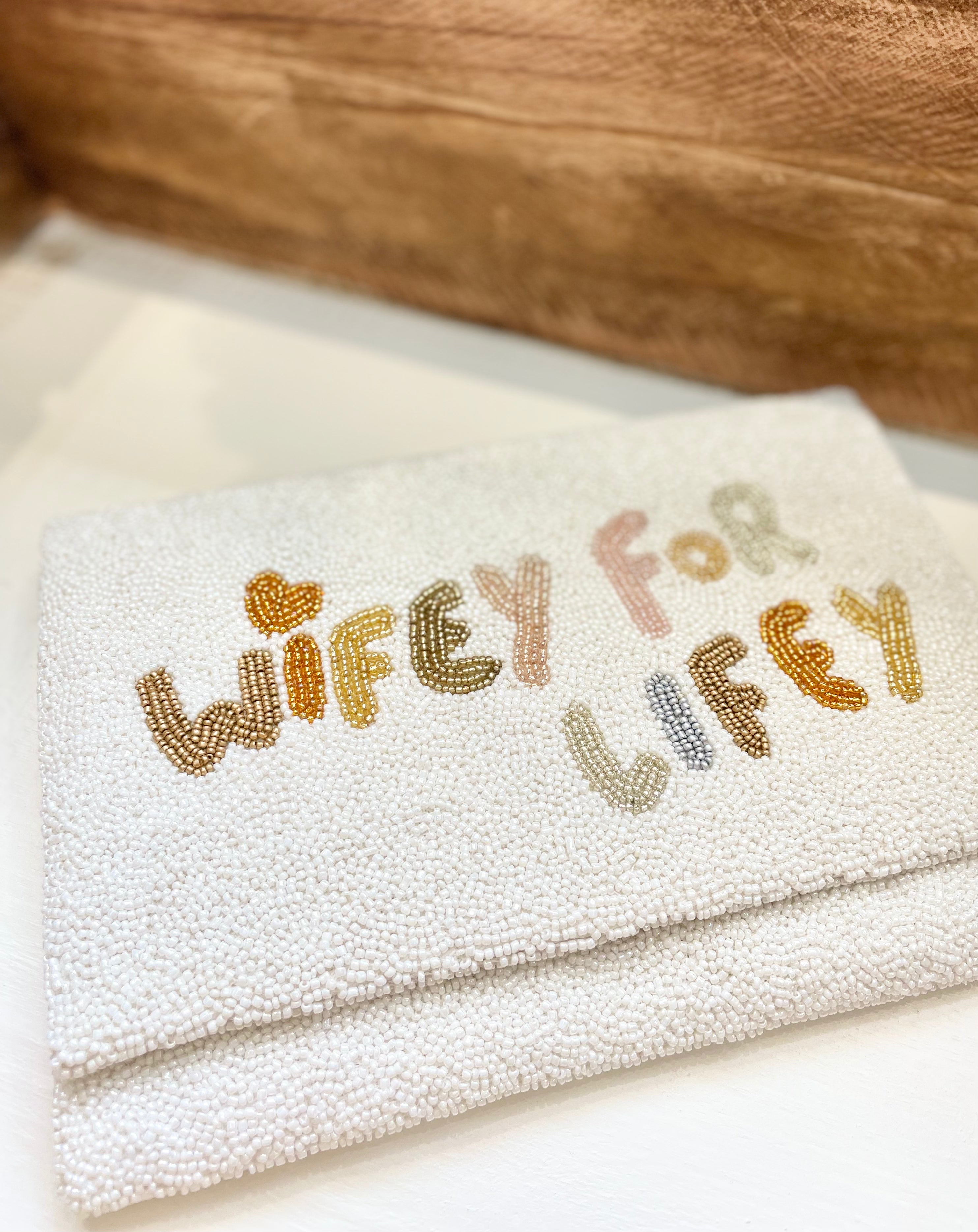wifey for lifey beaded bridal handbag on wooden shelf