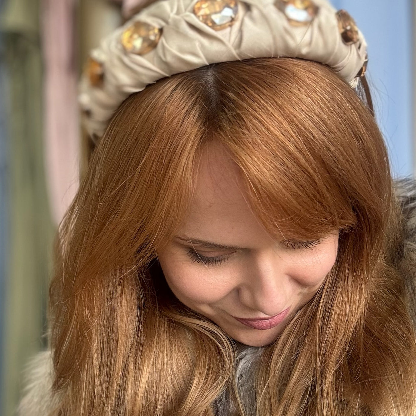 Lady wearing nude beige silk headband with crystals