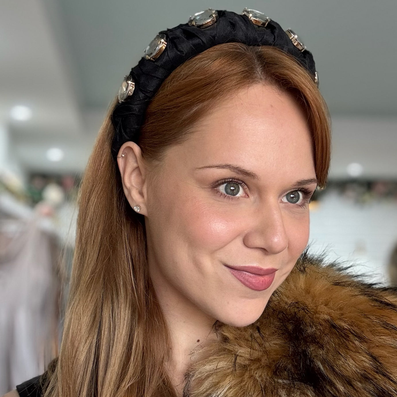 Lady wearing black headband with crystals