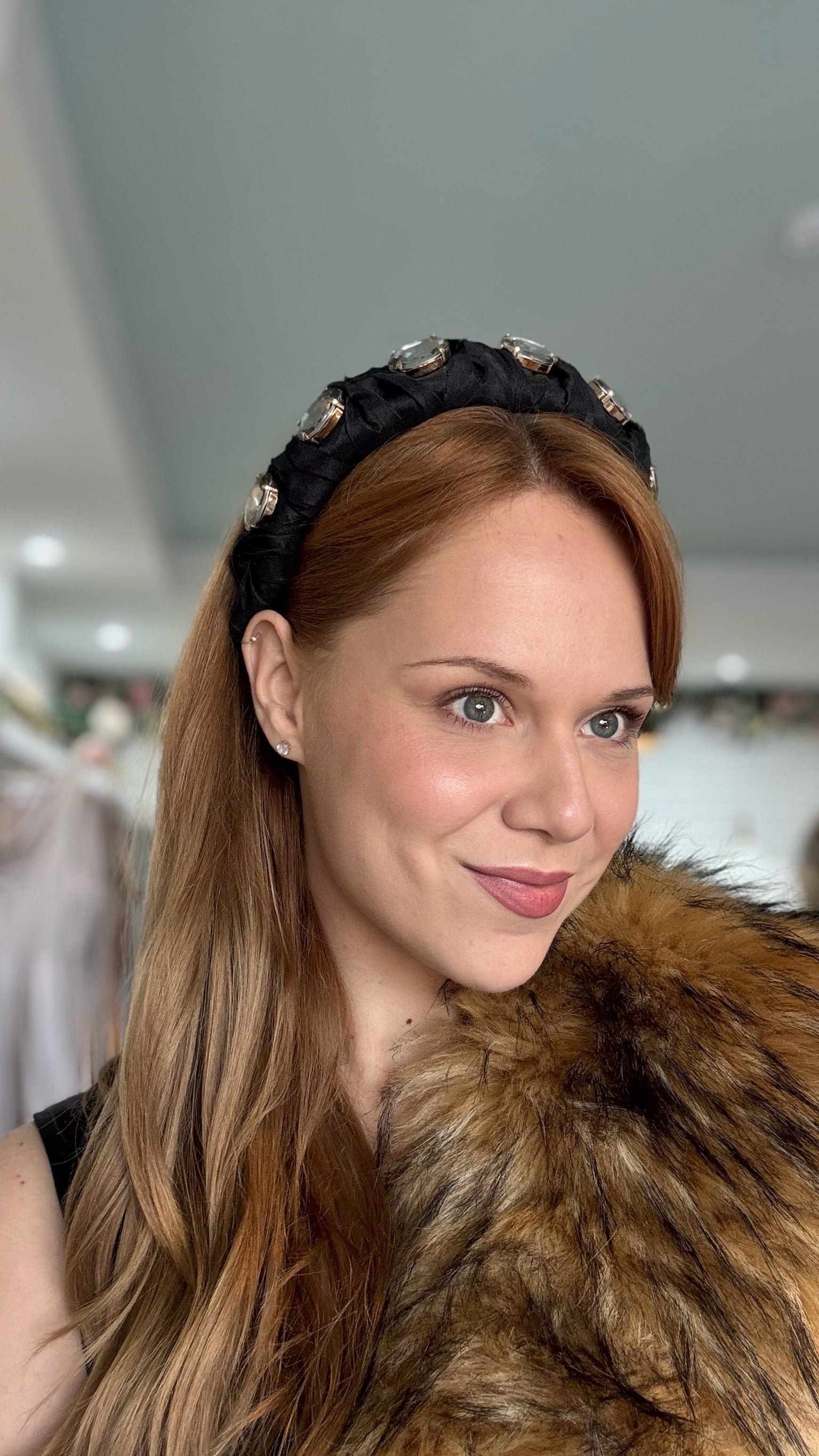 Lady wearing black headband with crystals