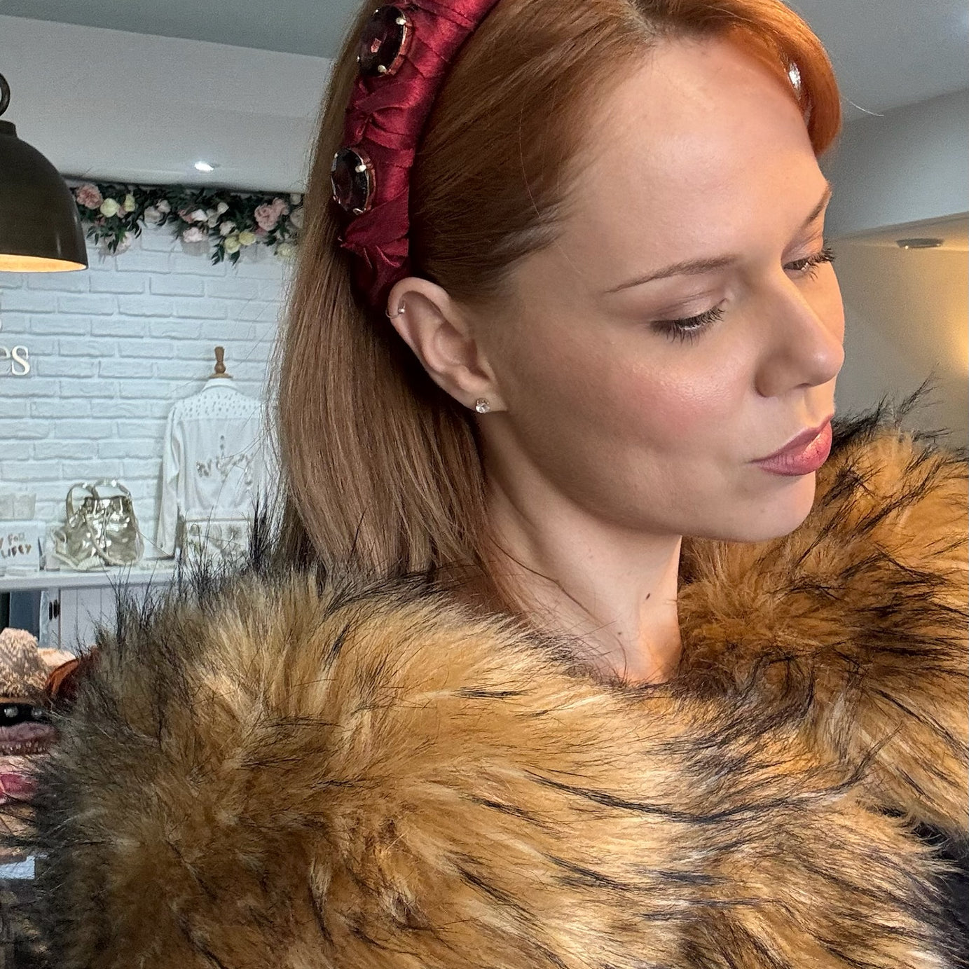 Lady wearing red silk headband with crystals
