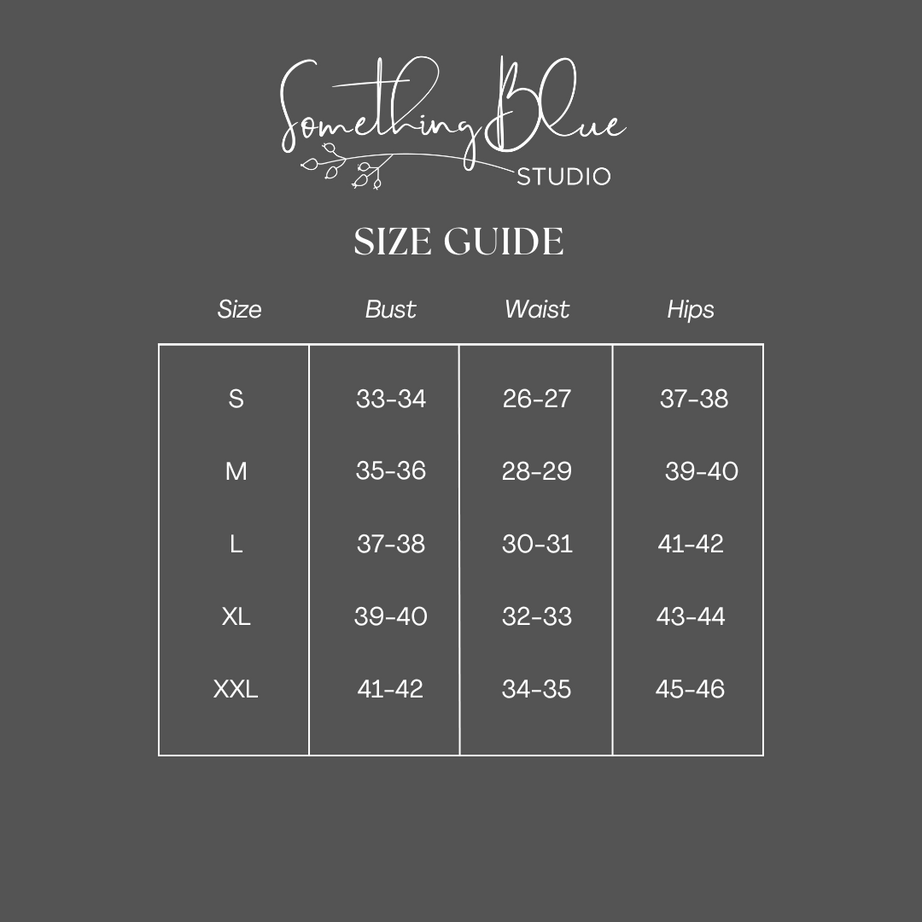 Size guide for clothing with measurements from Something Blue Studio on a dark gray background
