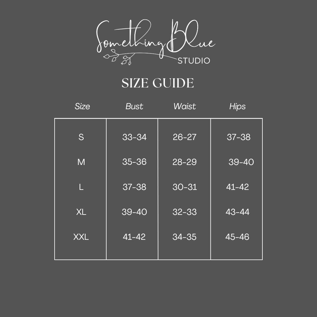 Size guide for clothing with measurements from Something Blue Studio on a dark gray background