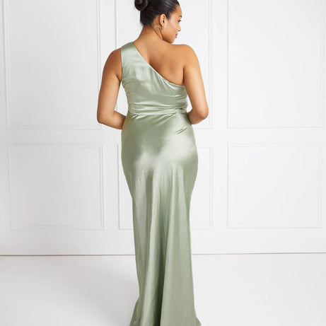 woman wearing pastel sage green one shoulder bridesmaid dress