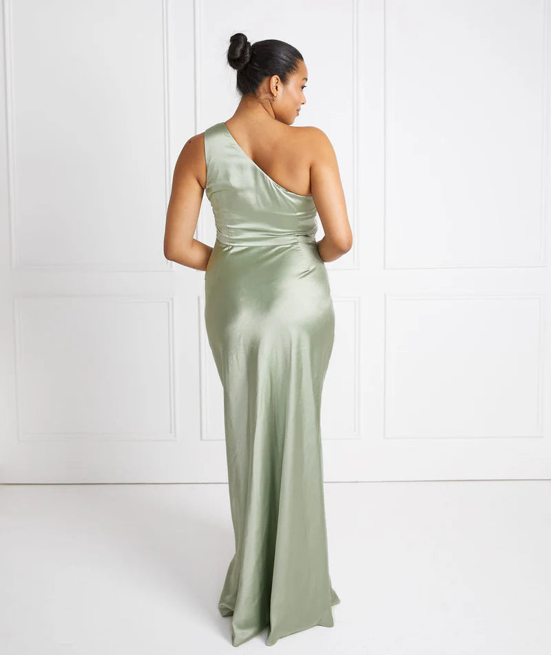 woman wearing pastel sage green one shoulder bridesmaid dress