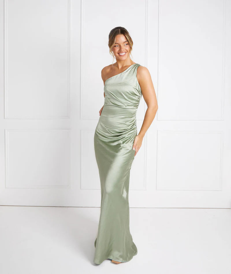 woman wearing pastel sage green one shoulder bridesmaid dress