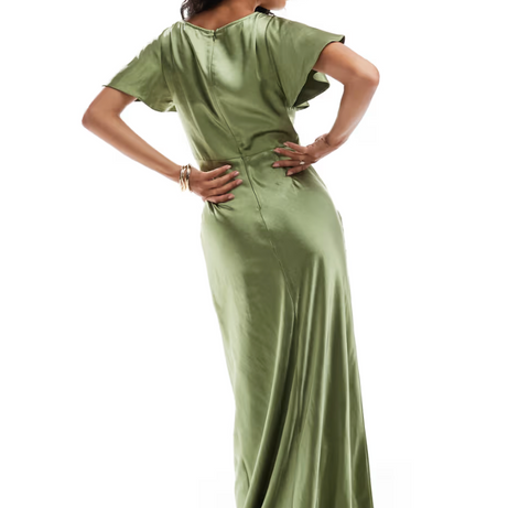 Woman wearing a moss green satin bridesmaid dress on a white background
