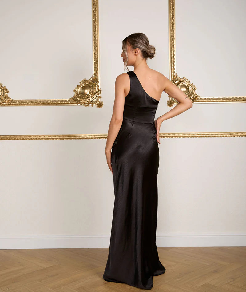 Woman wearing Six Stories Alex One shoulder bridesmaid dress in black
