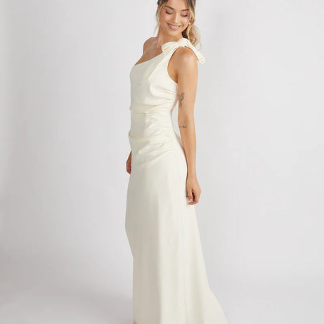 Woman wearing Six Stories crepe one shoulder bridesmaid dress in Almond colour