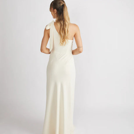 Woman wearing Six Stories crepe one shoulder bridesmaid dress in Almond colour
