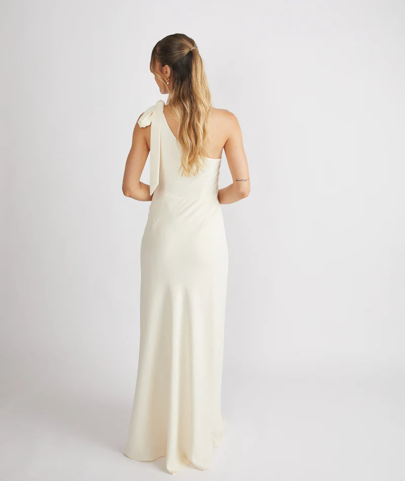 Woman wearing Six Stories crepe one shoulder bridesmaid dress in Almond colour