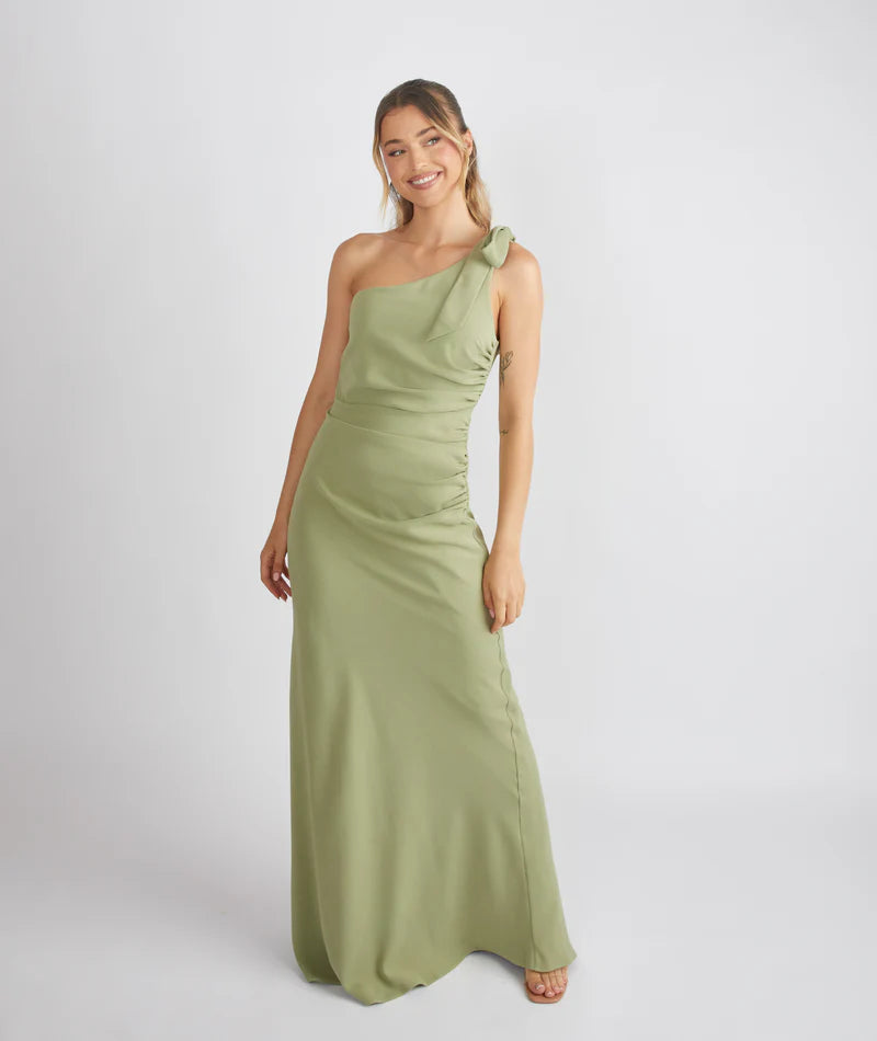 lady wearing crepe bow one shoulder bridesmaid dress in sage green