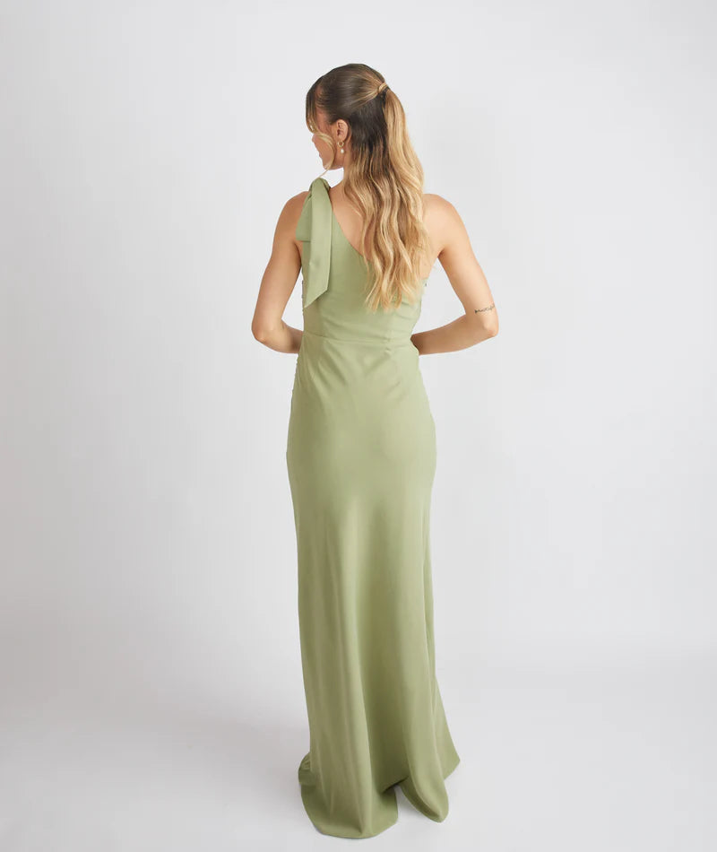 lady wearing crepe bow one shoulder bridesmaid dress in sage green