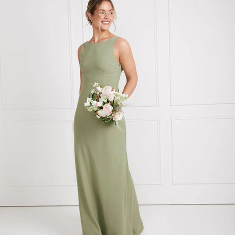Girl wearing sage green crepe bridesmaid dress