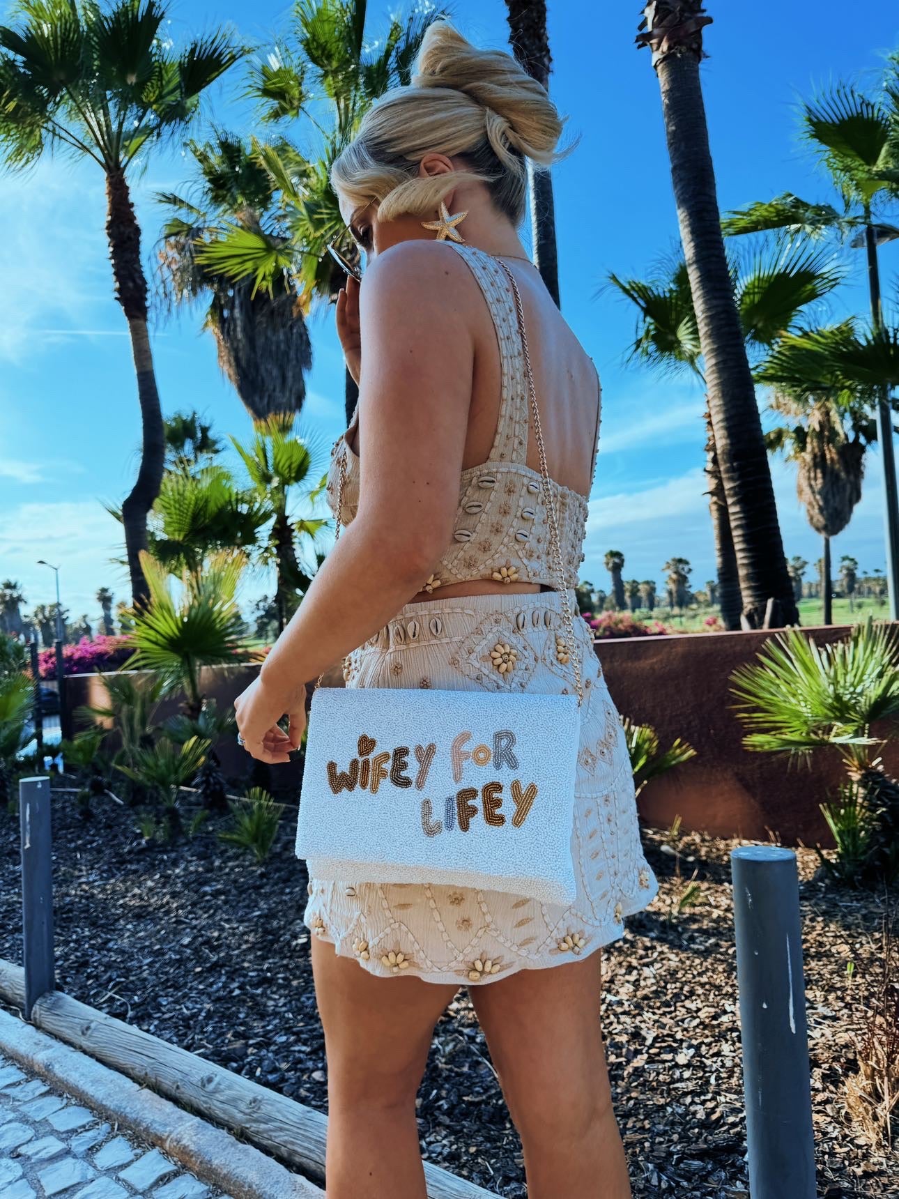 Girl wearing Wifey for Lifey Wedding Clutch Bag