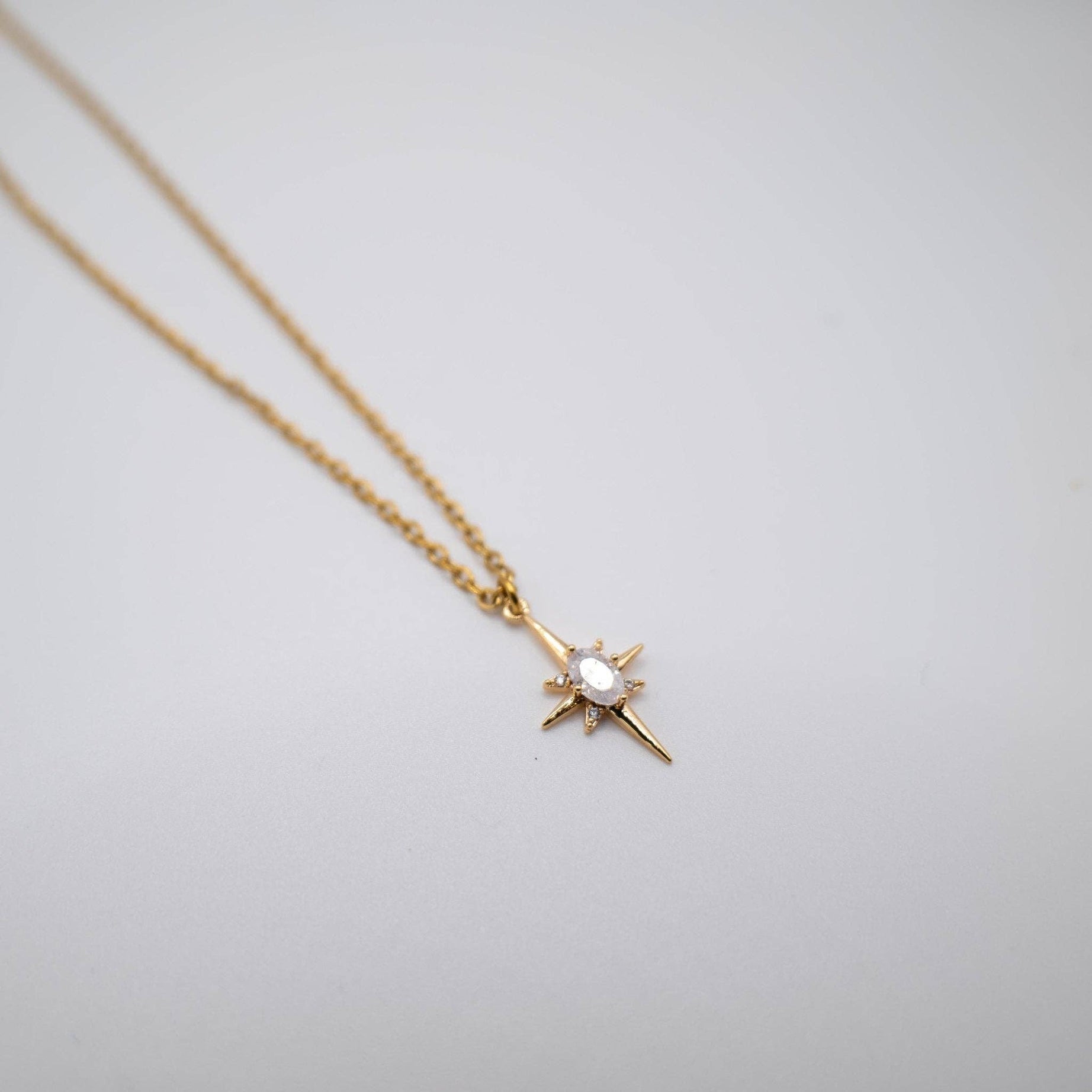 Shine like the night sky with our Starlet Necklace, a stunning celestial style design and timeless piece that brings a touch of the cosmos to your occasion look. This dainty necklace features a beautifully crafted gold star charm, inspired by celestial elegance, with a sparkling crystal centre that catches the light with every movement.
