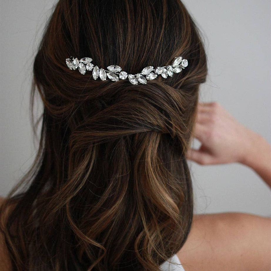 Add a radiant touch of glamour to your wedding day ensemble with the Skyla Crystal Headpiece—a breathtaking accessory designed to dazzle with every step you take. Whether you're envisioning a romantic garden ceremony or an elegant ballroom affair, Skyla brings a refined shimmer that enhances your bridal style with effortless beauty.