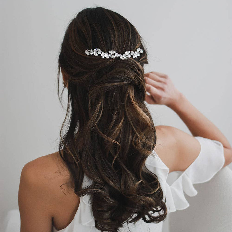 Add a radiant touch of glamour to your wedding day ensemble with the Skyla Crystal Headpiece—a breathtaking accessory designed to dazzle with every step you take. Whether you're envisioning a romantic garden ceremony or an elegant ballroom affair, Skyla brings a refined shimmer that enhances your bridal style with effortless beauty.