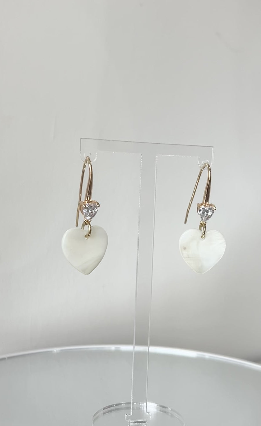 Video clip of mother of pearl heart shaped earrings